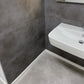   »Teide« SPC Vinylboden Unique Fliesenoptik an der Wand im Badezimmer